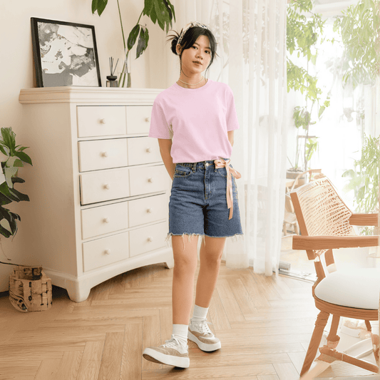 Female model wearing light pink oversized tshirt – minimal solid tshirt for men and women by Words Armor