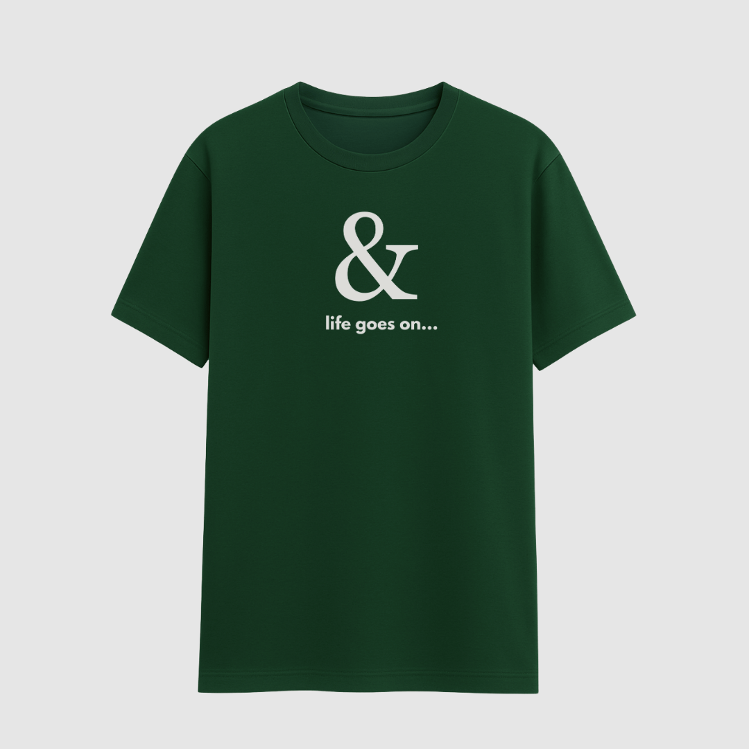 Green t-shirt with a white ampersand and text design on a light gray background wordsarmor