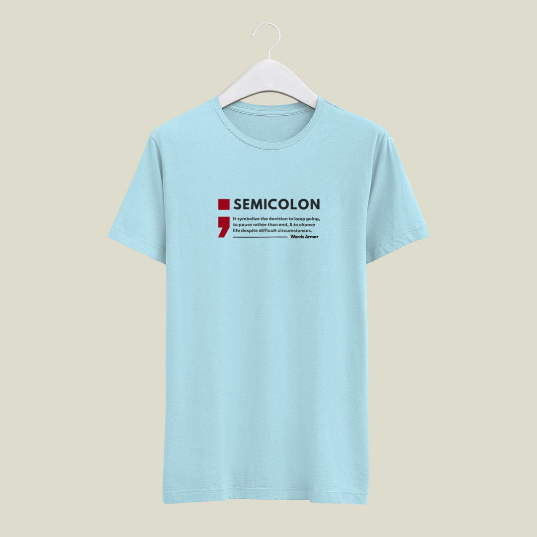 Baby blue t-shirt with a semicolon graphic design on a beige background words armor