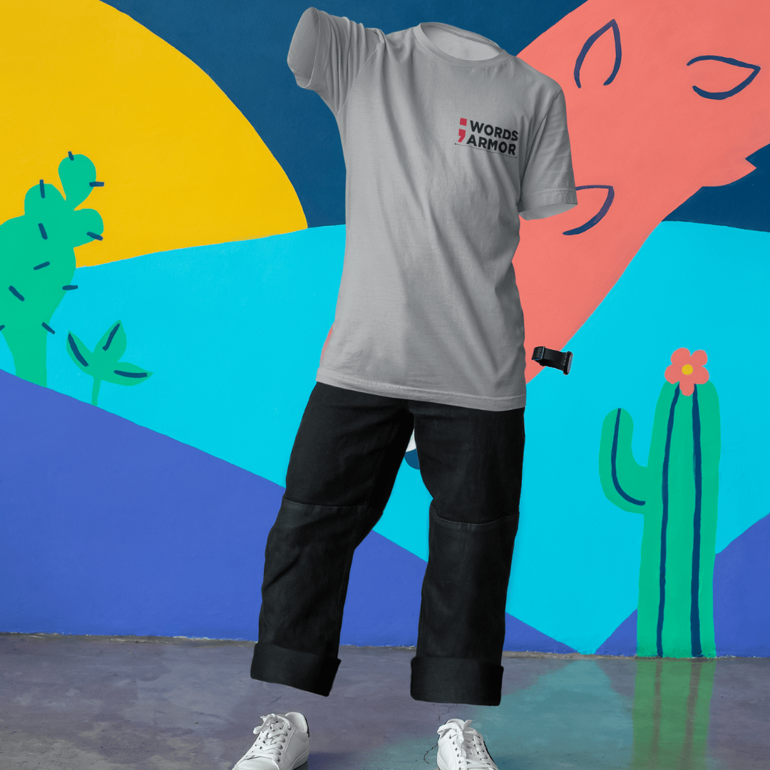 Gray t-shirt with a logo worn by a person against a colorful abstract background wordsarmor