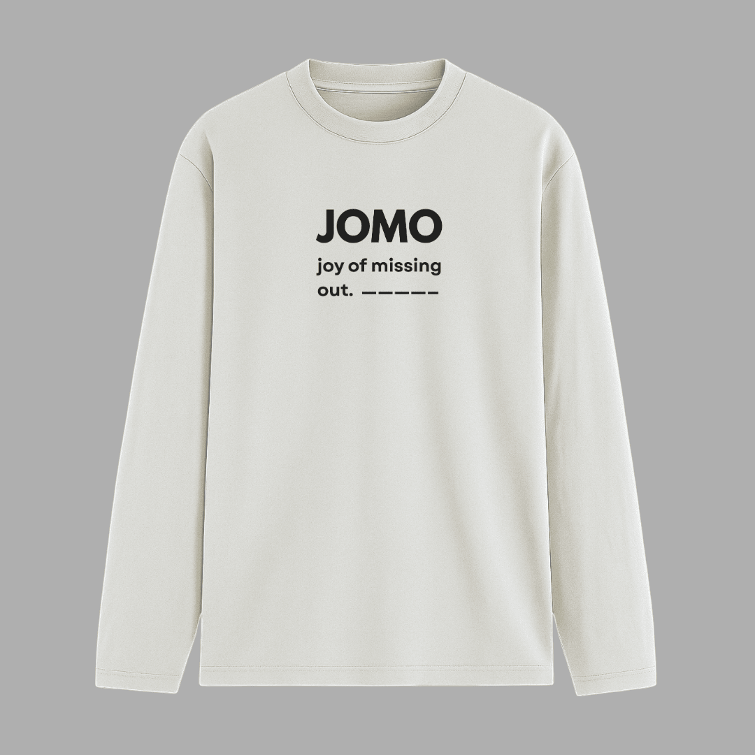 White long-sleeve shirt with 'JOMO joy of missing out' text on a grey background wordsarmor