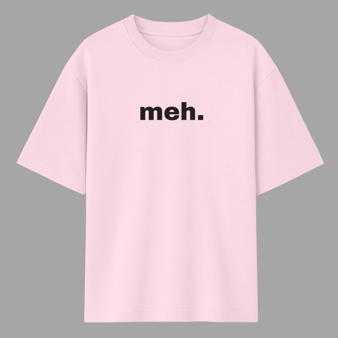 Pink t-shirt with 'meh.' text on a gray background wordsarmor