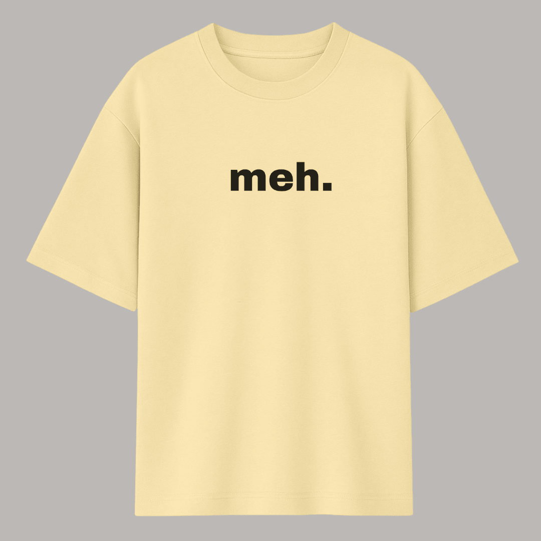 Beige t-shirt with 'meh.' text on a gray background wordsarmor