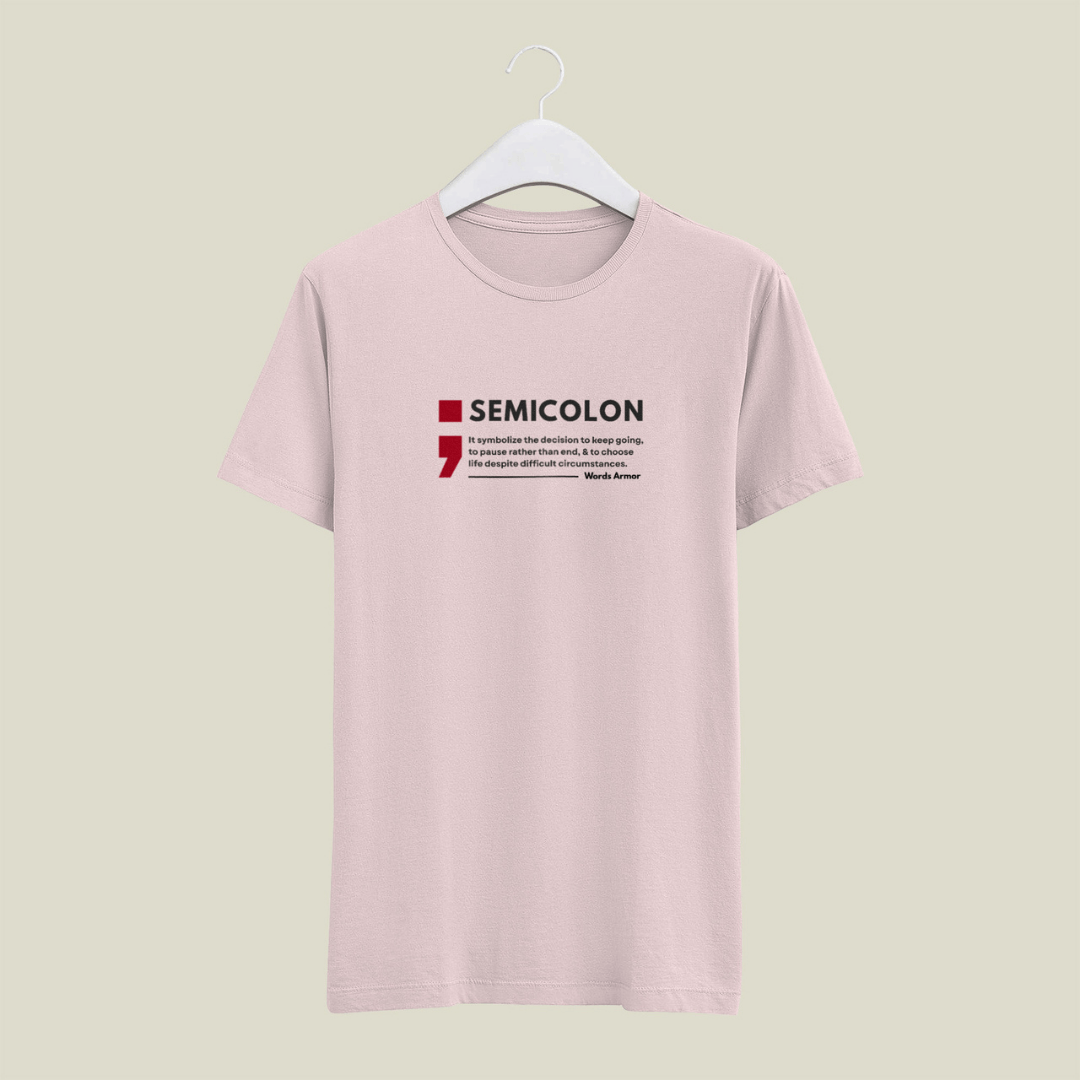 Peach t-shirt with 'SEMICOLON' design on a hanger against a light beige background wordsarmor