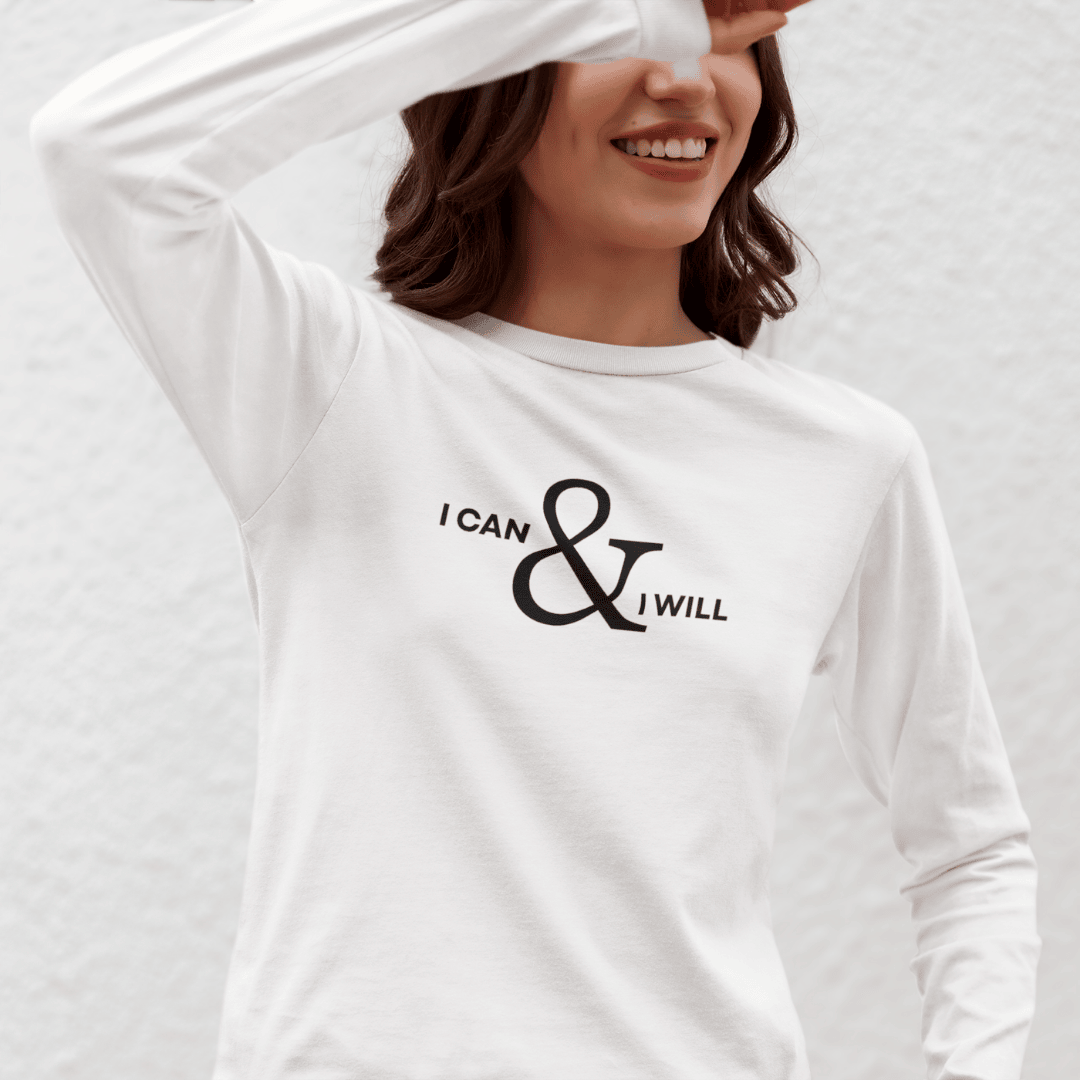 Person wearing a white long-sleeve shirt with 'I can & I will' text on a plain background wordsarmor