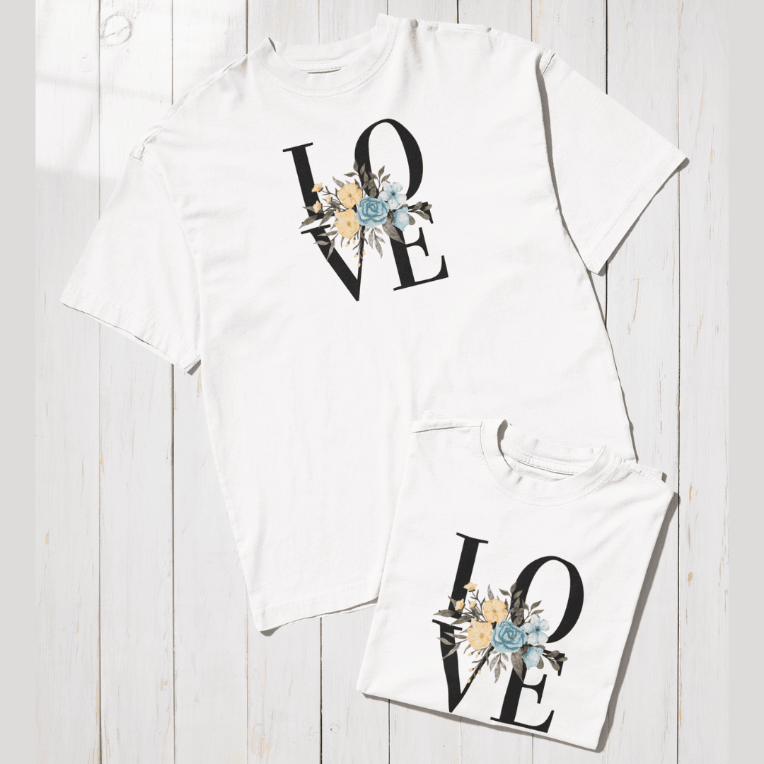 White t-shirt with 'LOVE' design on a wooden surface wordsarmor