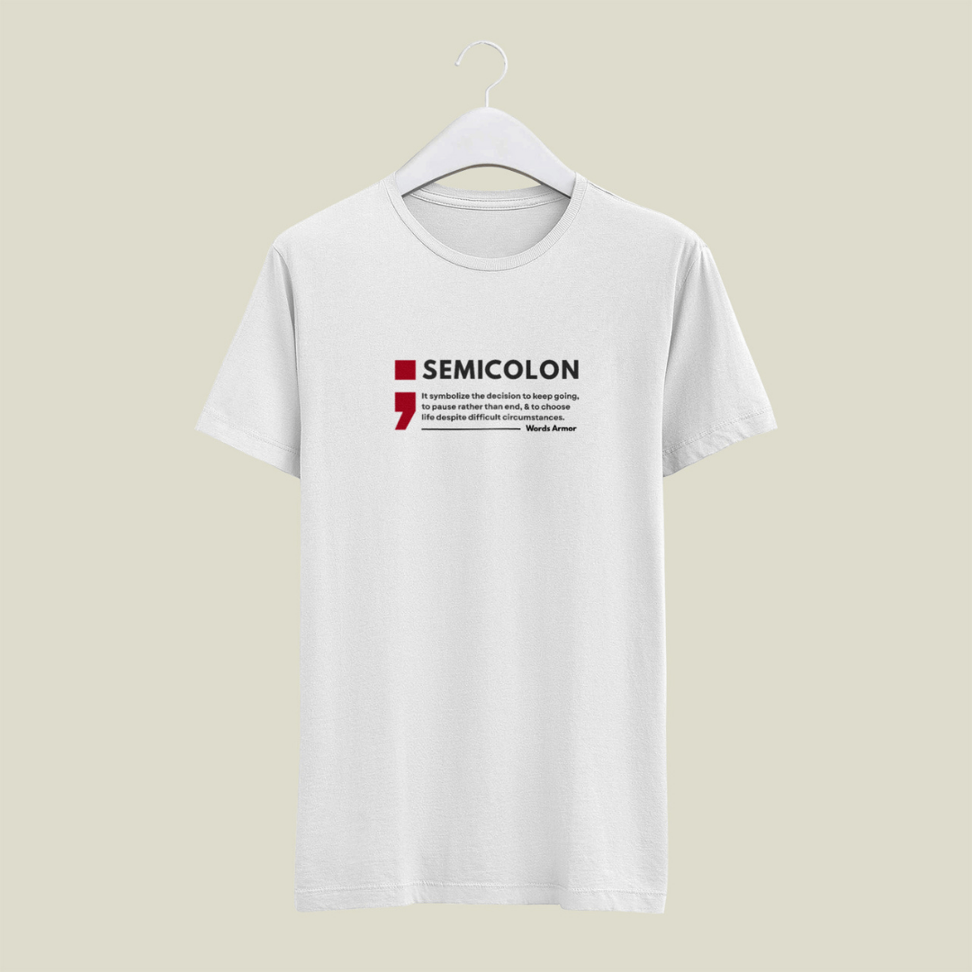 White t-shirt with 'SEMICOLON' design on a beige background wordsarmor