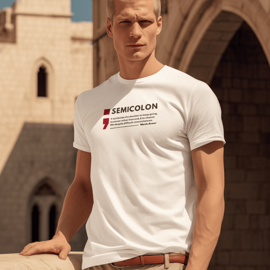 Person wearing a white t-shirt with 'SEMICOLON' design in front of a stone building. wordsarmor