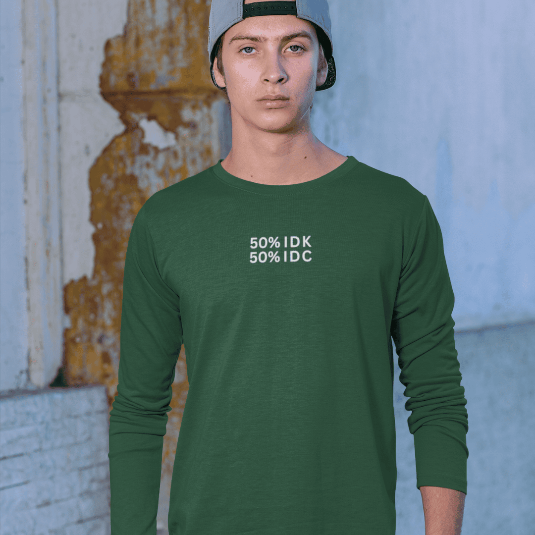 Person wearing a green long-sleeve shirt with text in an urban setting wordsarmor