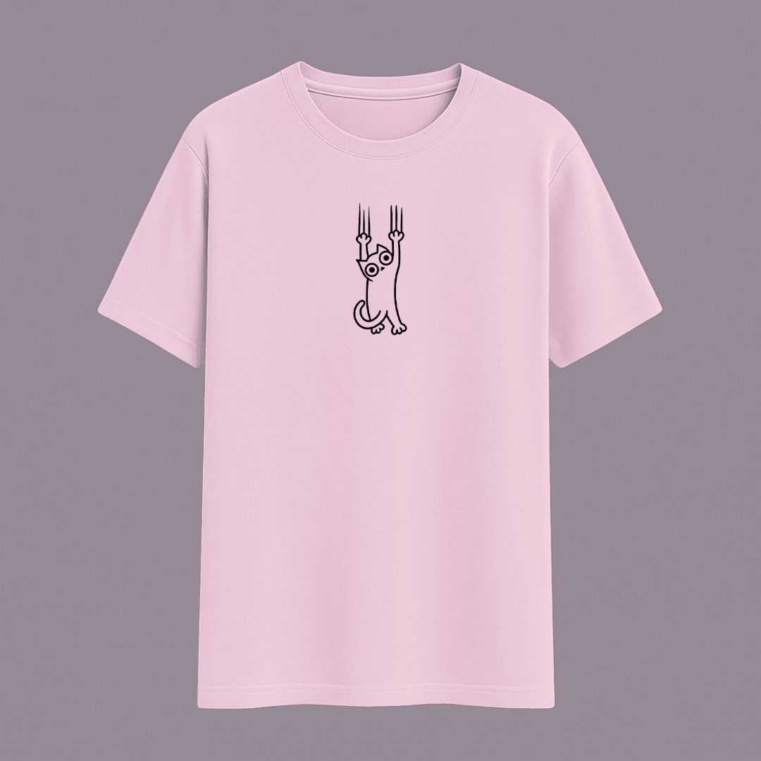 Cataholic Cat Lovers T-Shirt in baby pink colour with small cute cat print symbolizing faith and love.
