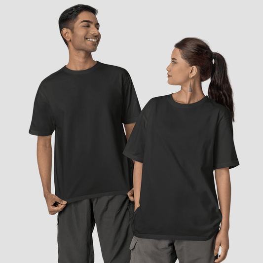 Unisex model wearing plain black oversized T-shirt – Words Armor India