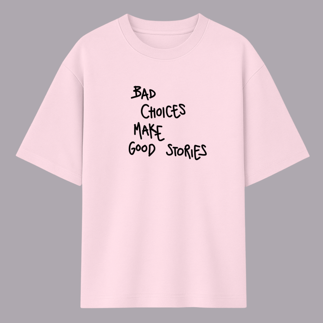 Quote oversized t-shirt for men and women by Words Armor with “Bad Choices Make Good Stories” print in lavender, baby pink, and white