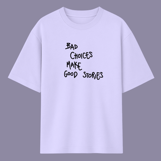 Quote oversized t-shirt for men and women by Words Armor with “Bad Choices Make Good Stories” print in lavender, baby pink, and white