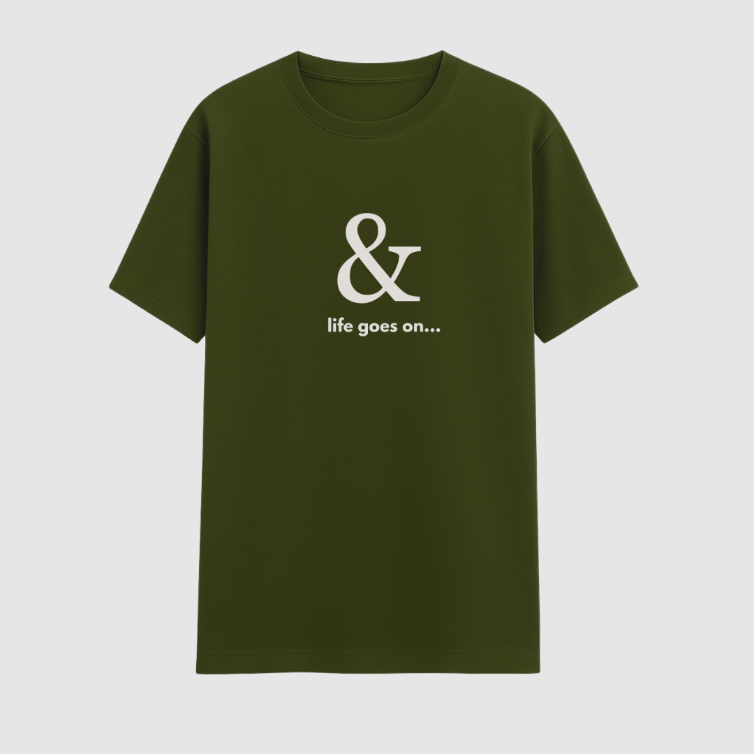 Green t-shirt with a white ampersand and text on a light gray background wordsarmor
