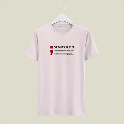Baby Pink t-shirt with 'SEMICOLON' design on a hanger against a light green background wordsarmor