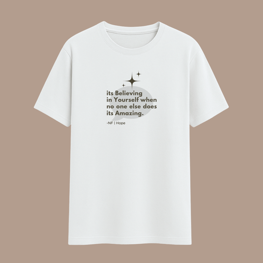 White t-shirt with motivational quote on a beige background wordsarmor