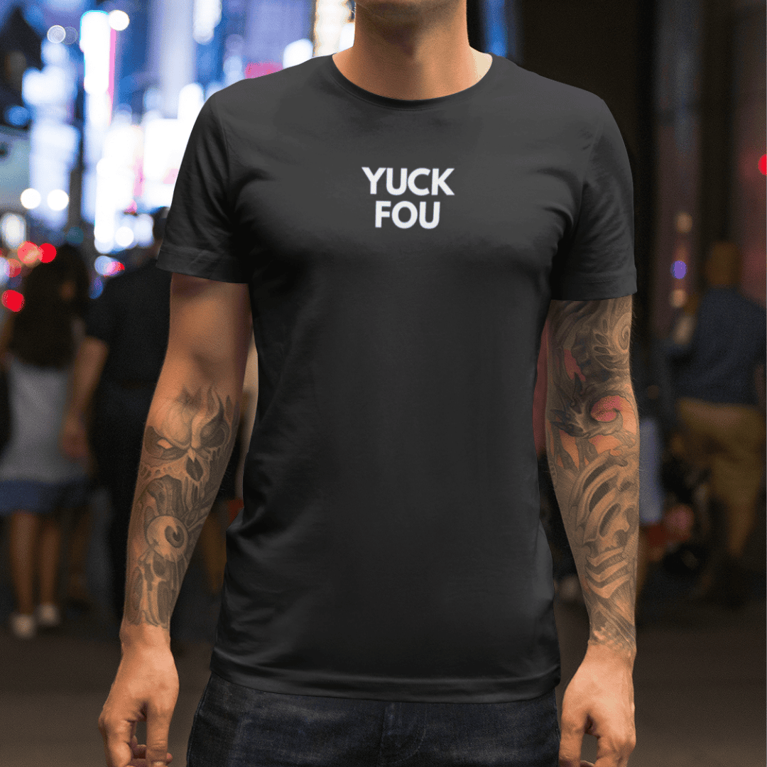 Person wearing a black t-shirt with 'YUCK FOU' text in a city street setting wordsarmor.