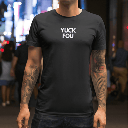 Person wearing a black t-shirt with 'YUCK FOU' text in a city street setting wordsarmor.