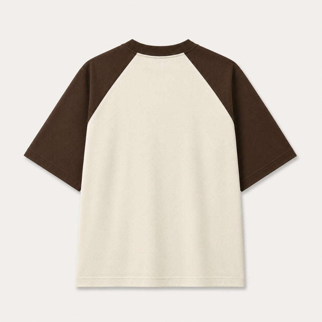 Back view of Words Armor khan Badosh Nomad Urdu oversized raglan t-shirt for men and women in coffee brown and off white made from premium 240 GSM cotton.