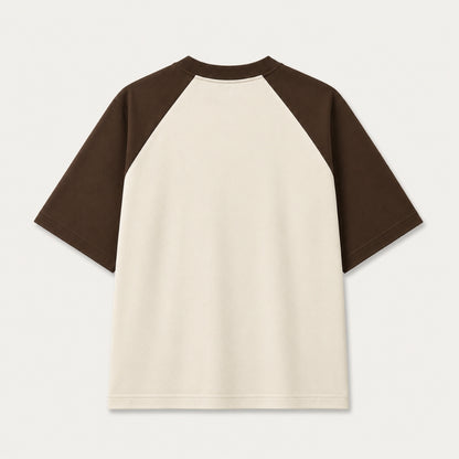 Back view of Words Armor khan Badosh Nomad Urdu oversized raglan t-shirt for men and women in coffee brown and off white made from premium 240 GSM cotton.