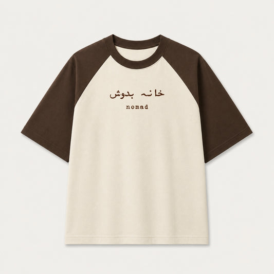 Words Armor Khana Badosh Nomad Urdu oversized raglan t-shirt for men and women in coffee brown and off white featuring Khana Badosh typography on premium 240 GSM cotton.