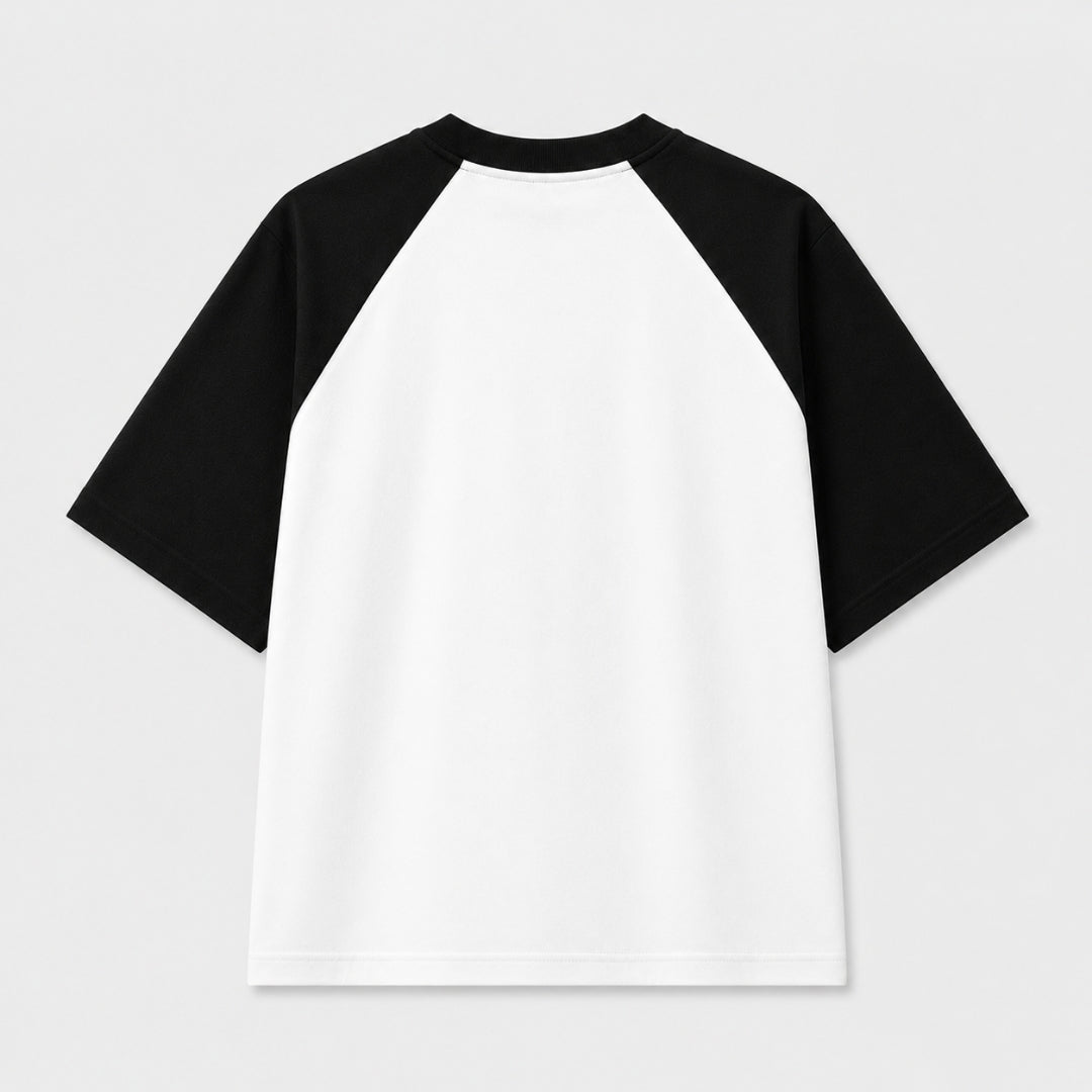 Words Armor Revolution typography oversized white and black raglan T-Shirt for men and women with minimalist streetwear graphic.