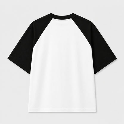 Words Armor Revolution typography oversized white and black raglan T-Shirt for men and women with minimalist streetwear graphic.