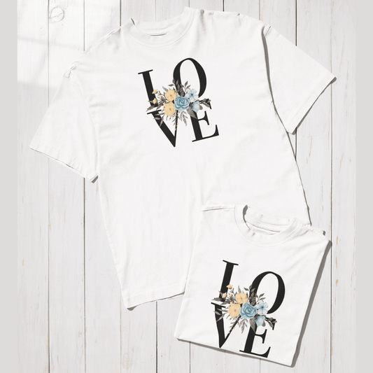White t-shirt with 'LOVE' design on a wooden surface wordsarmor