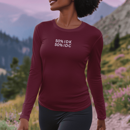 Person wearing a maroon long-sleeve shirt with text in a mountainous landscape wordsarmor